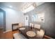 Chandelier-lit dining room with wood floors and modern decor at 9322 Straw Hays St # 103, Las Vegas, NV 89178