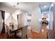 Dining area with a chandelier, neutral walls, and wooden floors at 9322 Straw Hays St # 103, Las Vegas, NV 89178