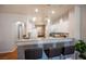 Bright kitchen with white cabinetry, stone countertops, and stainless appliances at 9322 Straw Hays St # 103, Las Vegas, NV 89178
