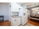Bright kitchen area with white cabinetry and modern appliances, adjoins to dining area at 9322 Straw Hays St # 103, Las Vegas, NV 89178