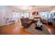 Inviting living room featuring hardwood floors, comfortable seating, and natural lighting at 9322 Straw Hays St # 103, Las Vegas, NV 89178