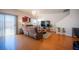 Inviting living room with hardwood floors, comfortable seating, and sliding glass door at 9322 Straw Hays St # 103, Las Vegas, NV 89178