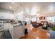 Bright living room seamlessly connected to a modern kitchen, complete with a breakfast bar at 9322 Straw Hays St # 103, Las Vegas, NV 89178