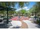Outdoor park featuring shaded picnic tables and fitness equipment for residents to enjoy at 9322 Straw Hays St # 103, Las Vegas, NV 89178