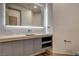 Sleek bathroom featuring a backlit mirror, modern fixtures, and stylish cabinetry at 9921 Mirada Dr, Las Vegas, NV 89144