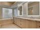 Bright bathroom with glass block window and modern vanity at 9921 Mirada Dr, Las Vegas, NV 89144