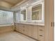 Spa-like bathroom with double vanity and soaking tub at 9921 Mirada Dr, Las Vegas, NV 89144