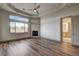 Spacious bedroom with wood floors, a fireplace, and large windows, offering abundant natural light at 9921 Mirada Dr, Las Vegas, NV 89144