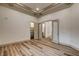 Bedroom featuring wood floors, walk in closet and doors to adjoined sitting area at 9921 Mirada Dr, Las Vegas, NV 89144