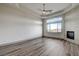 Spacious bedroom with tray ceilings, fireplace and big picture windows at 9921 Mirada Dr, Las Vegas, NV 89144