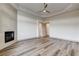 Large bedroom with wood-look floors, fireplace, and a neutral color scheme at 9921 Mirada Dr, Las Vegas, NV 89144