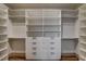 Large walk-in closet featuring custom shelving, drawers, and ample hanging space for organized storage at 9921 Mirada Dr, Las Vegas, NV 89144