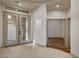 Grand entryway with double doors, tile flooring, and open access to other rooms at 9921 Mirada Dr, Las Vegas, NV 89144