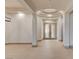 Bright foyer with neutral tile floors and modern lighting, offers a welcoming entrance and open flow at 9921 Mirada Dr, Las Vegas, NV 89144