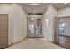 Bright foyer featuring tile flooring and double doors at 9921 Mirada Dr, Las Vegas, NV 89144