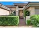 Close-up of the front entrance with an ornate security gate and manicured hedges for added privacy at 9921 Mirada Dr, Las Vegas, NV 89144