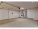 Spacious garage featuring epoxy flooring and ample room for storage and parking at 9921 Mirada Dr, Las Vegas, NV 89144