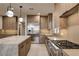 Bright kitchen showcasing an island, stainless steel appliances, modern cabinets, and gas range at 9921 Mirada Dr, Las Vegas, NV 89144