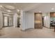 Open-concept living space with tray ceiling and tile flooring at 9921 Mirada Dr, Las Vegas, NV 89144