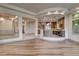 Open living space showcasing hardwood floors and seamless transition to the kitchen at 9921 Mirada Dr, Las Vegas, NV 89144