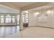 Open-concept living space featuring natural light and decorative chandelier at 9921 Mirada Dr, Las Vegas, NV 89144