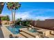 Backyard pool features lush landscaping and a clear blue sky at 9921 Mirada Dr, Las Vegas, NV 89144