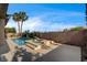 Resort-style pool area showcasing palm trees and a serene backyard escape at 9921 Mirada Dr, Las Vegas, NV 89144
