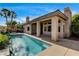 Exterior view showcases the pool and covered patio with柱 at 9921 Mirada Dr, Las Vegas, NV 89144