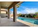 Inviting backyard pool with elegant columns, desert landscaping, and a refreshing outdoor space at 9921 Mirada Dr, Las Vegas, NV 89144