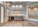 Elegant wet bar area equipped with a wine fridge and custom cabinetry at 9921 Mirada Dr, Las Vegas, NV 89144