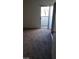 A view of a bedroom with a sliding glass door to the outdoor patio at 1336 N Jones Blvd, Las Vegas, NV 89108
