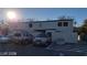 Two-story residential complex building exterior showcasing parking lot, covered parking, and gray and neutral colored stucco at 1336 N Jones Blvd, Las Vegas, NV 89108