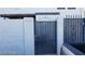 Gated residential entrance of complex with light gray stucco wall with black wrought iron gate to small courtyard at 1336 N Jones Blvd, Las Vegas, NV 89108