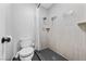 Bathroom with a toilet and updated shower with neutral-colored tile and modern fixtures at 1405 Vegas Valley Dr # 98, Las Vegas, NV 89169