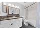 Bathroom featuring a vanity with granite countertop, a mirror, and a shower/tub combo at 1405 Vegas Valley Dr # 98, Las Vegas, NV 89169