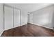 Bright bedroom with hardwood floors, closet, and a white door at 1405 Vegas Valley Dr # 98, Las Vegas, NV 89169