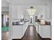Modern kitchen with stainless steel appliances, granite countertops, and dark wood flooring at 1405 Vegas Valley Dr # 98, Las Vegas, NV 89169