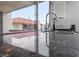 Close-up of granite countertops and kitchen faucet, featuring white cabinets and stainless steel microwave at 1405 Vegas Valley Dr # 98, Las Vegas, NV 89169