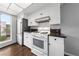 Bright kitchen featuring stainless steel appliances, white cabinets, and a window view at 1405 Vegas Valley Dr # 98, Las Vegas, NV 89169