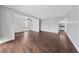 Spacious living room featuring hardwood floors and a ceiling fan; bathroom entrance on right at 1405 Vegas Valley Dr # 98, Las Vegas, NV 89169