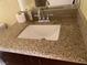 Bathroom featuring a granite countertop with a white sink and chrome faucet at 1505 Frank Aved St # 101, Las Vegas, NV 89110