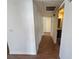 Bright hallway featuring wood-look tile flooring and access to bathroom and rooms at 1505 Frank Aved St # 101, Las Vegas, NV 89110