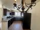 Kitchen featuring granite counters, tile floors, dark cabinetry, and stainless steel appliances at 1505 Frank Aved St # 101, Las Vegas, NV 89110
