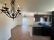Kitchen view featuring dark cabinets, gas range and stove, tile floors, and eat-in bar area at 1505 Frank Aved St # 101, Las Vegas, NV 89110