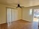 Bright living room features tile floors, ceiling fan, and sliding glass doors to the balcony at 1505 Frank Aved St # 101, Las Vegas, NV 89110