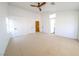 Spacious bedroom with neutral carpet, multiple closets, and an ensuite bathroom at 1519 Deerford Cir, Las Vegas, NV 89110