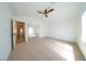Large vacant bedroom with neutral carpet and a mirrored closet at 1519 Deerford Cir, Las Vegas, NV 89110