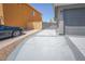 Extended driveway alongside the house providing additional parking at 1519 Deerford Cir, Las Vegas, NV 89110