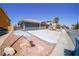 Charming home featuring a spacious two-car garage and well-maintained desert landscaping at 1519 Deerford Cir, Las Vegas, NV 89110