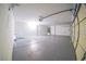 Three car garage featuring epoxy floors, finished walls, and garage door openers at 1519 Deerford Cir, Las Vegas, NV 89110